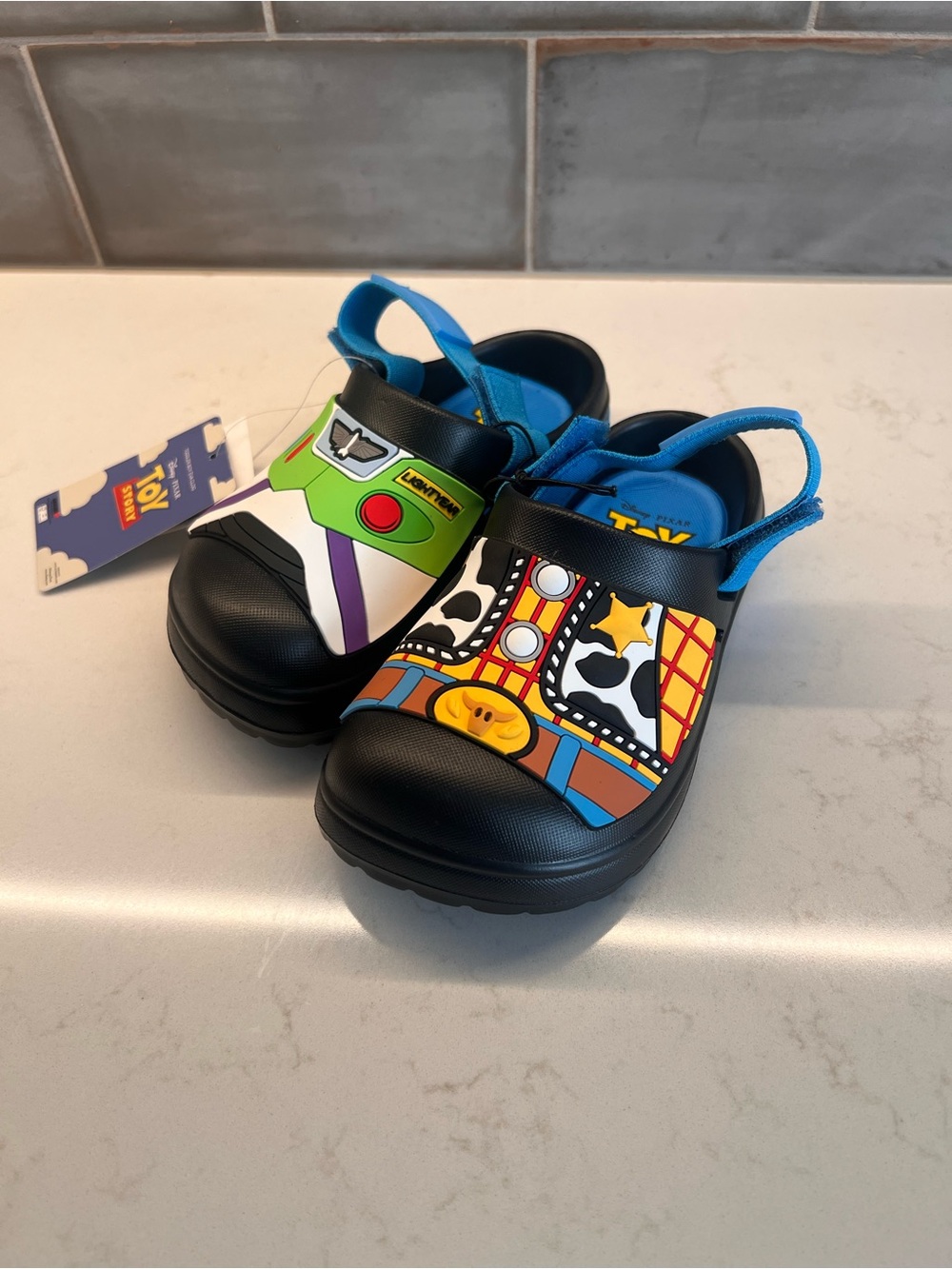 Kids Black Toy Story Slip-On Clogs with Blue Strap